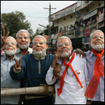 Supporters of Bharatiya Janata Party (BJP) wear masks of Gujarat state Chief Minister Narendra Modi 